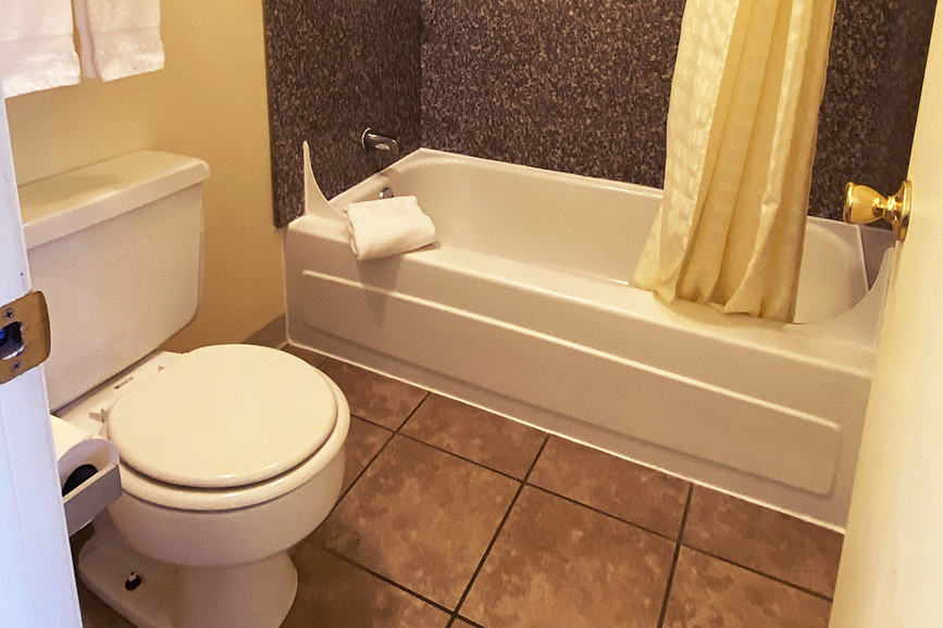 Bathroom tub yellow room
