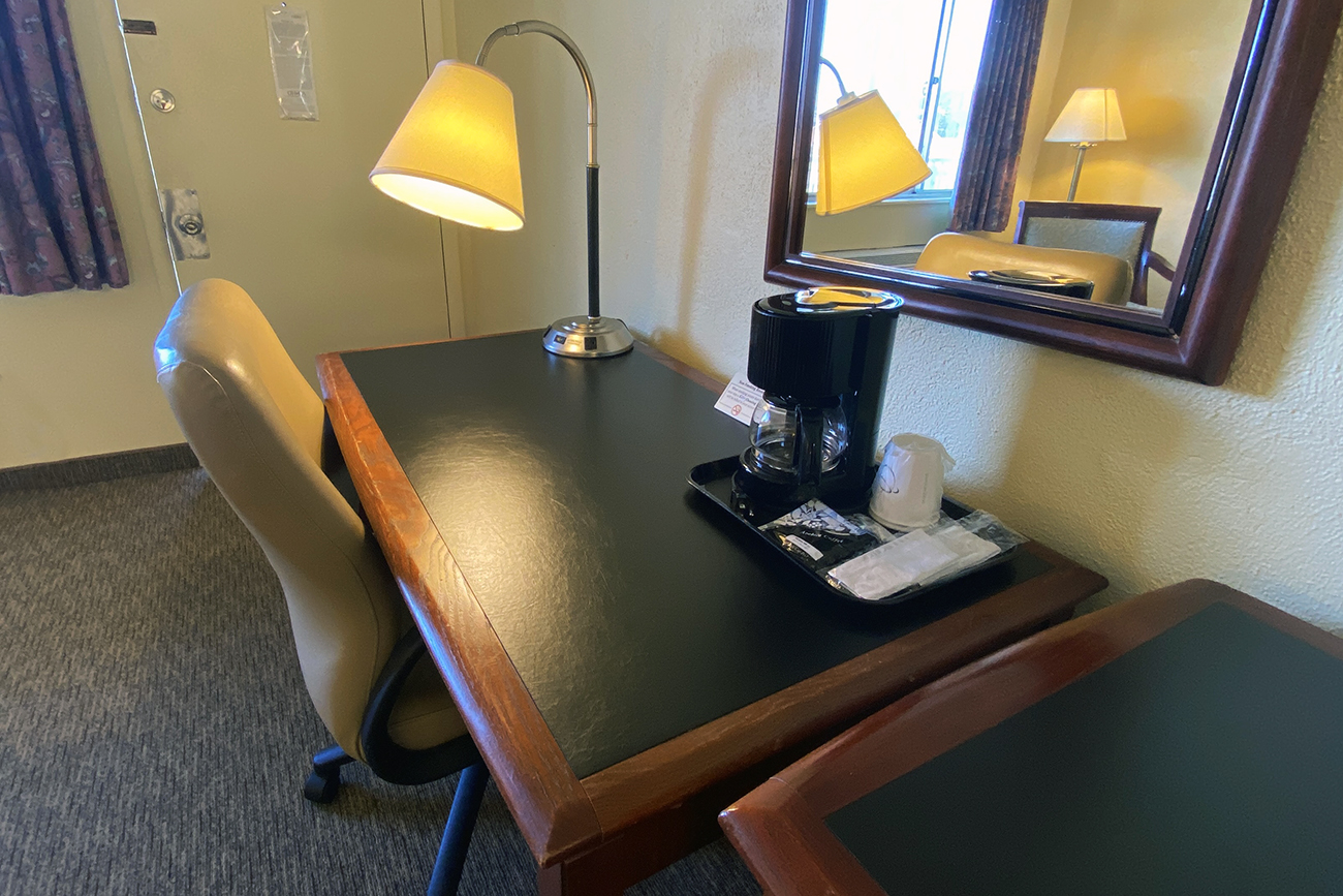 Desk and coffee pot yellow room